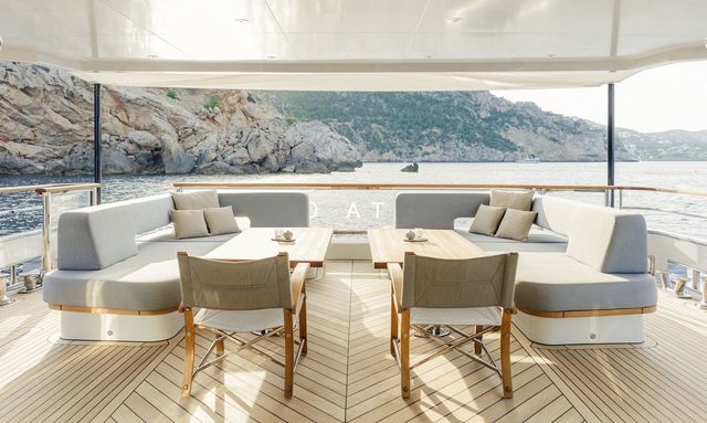 Delta One yacht Dining for Ten on Deck