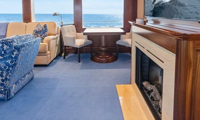 Ostara yacht Skylounge with fireplace