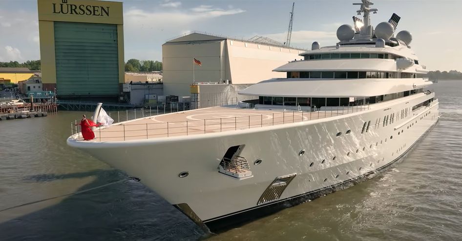 Overview of Lurssen superyacht OPERA bow, underway enroute to sea trials with Lurssen facility in background.