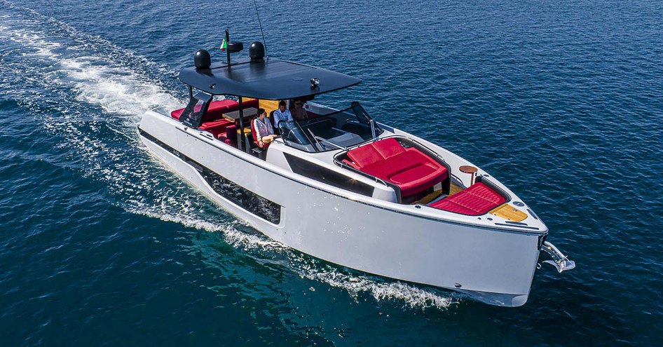 Couple at helm of A46 Luxury Tender on open water