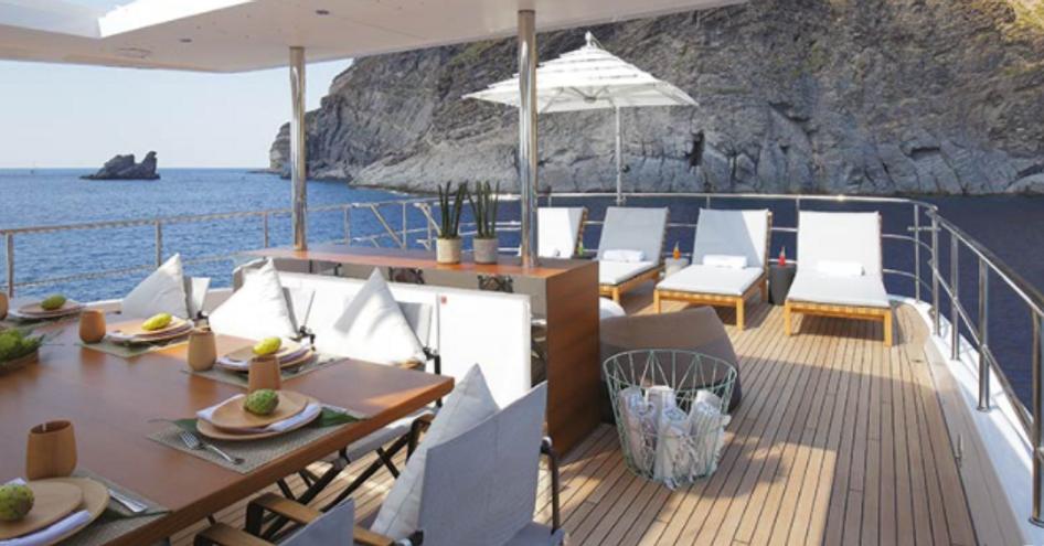 Overview of the sun deck onboard Motor yacht LOUI with multiple sunloungers and parasols