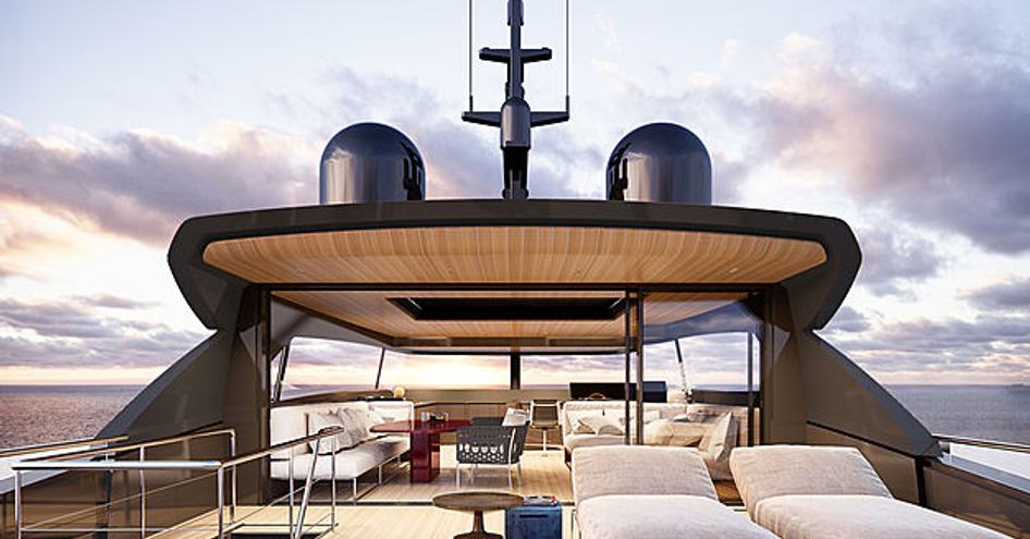 Rear view of Sanlorenzo SX112 crossover yacht flybridge, overlooking sunloungers, and looking in to a spacious skylounge with cream upholstery.