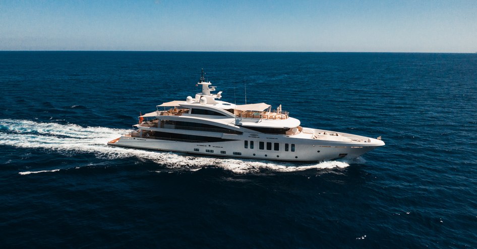 Amels 200 superyacht MOONSTONE showing her starboard side while running through the sea