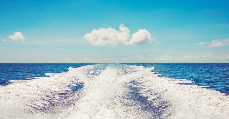 Yacht wash in clear sea and sky