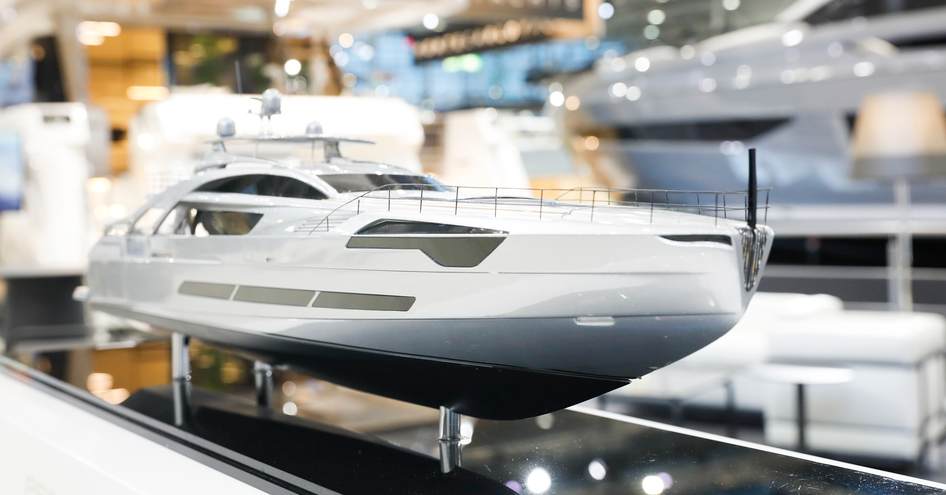 Scale model of a motoryacht on display in a case at Boot Dusseldorf.