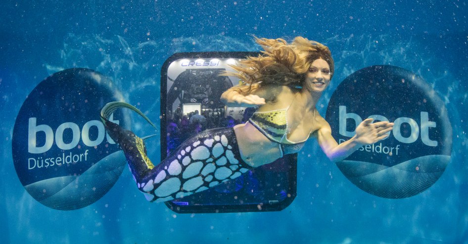 Watersports demonstrator swimming like mermaid at Boot Dusseldorf event