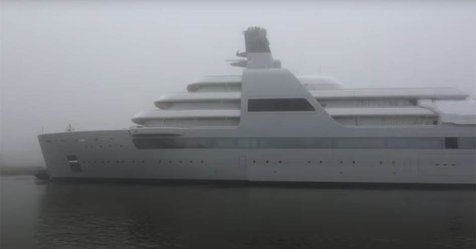 Side view of superyacht SOLARIS launch ceremony, shrouded in fog