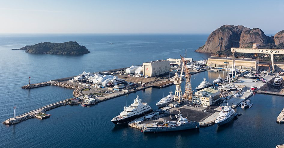 Elevated overview of docks at Monaco Marine Antibes, motor yachts moored, surrounded by sea