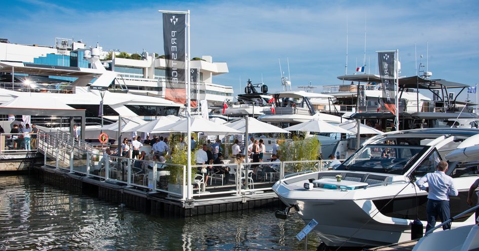 Display of motor yachts at the Cannes Yachting Festival with Prestige flags