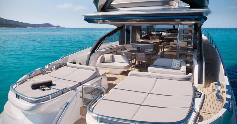 Aft deck onboard Princess S80. Large duo of sunpads in foreground with alfresco lounge area aft. Yacht is surrounded by sea.