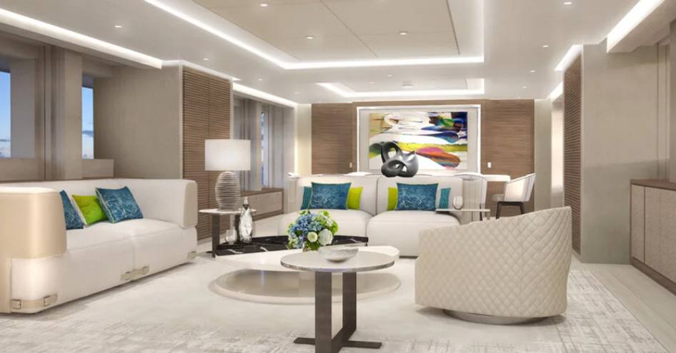 Main salon onboard Heesen Project Aura, white sofa and chairs facing centre around coffee table, blue and green accents around