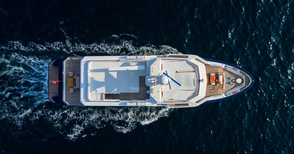 An aerial running shot of SEVEN SEAS, showcasing its expansive deck spaces