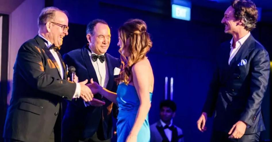 A Yacht Style Award winner shaking hands with presenter on stage