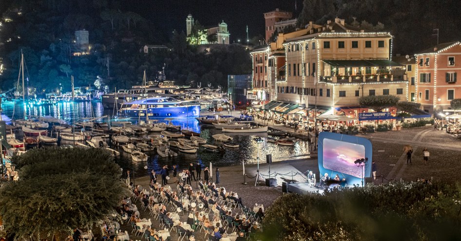 Azimut Benetti Portofino event by marina, press seated outdoors to watch a short film