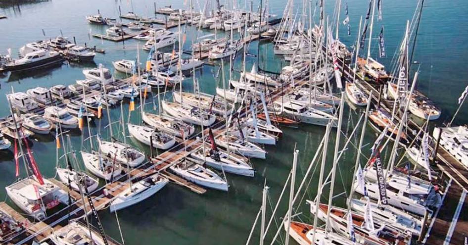 Sailing boats at dock during Southampton International Boat Show, surrounded by sea