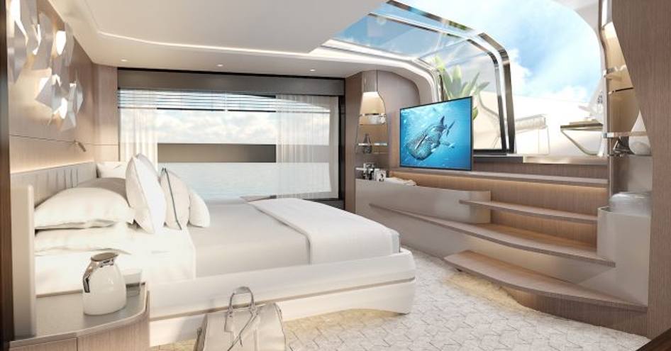 white bed faces a TV and steps which lead up to the foredeck in the master suite of Sunseeker 100 Yacht