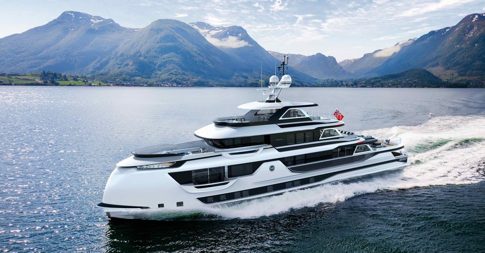 Dynamiq Global Series yacht on water with mountainous background