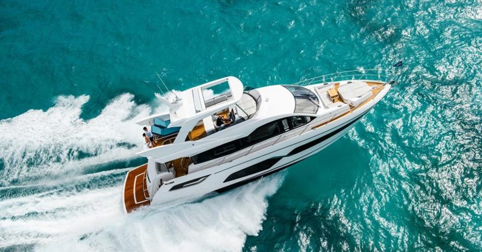 Aerial view of Sunseeker Manhattan 68 underway, surrounded by sea