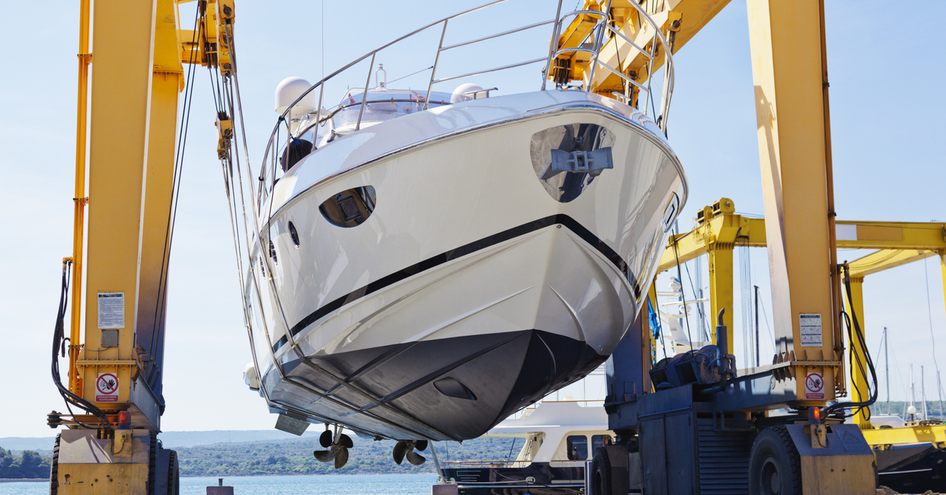 yacht in a boat lift for a survey