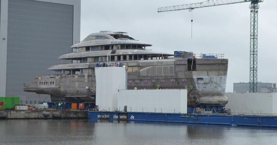 Lurssen superyacht Ace 21 emerging from shed at Bremerhaven facility.