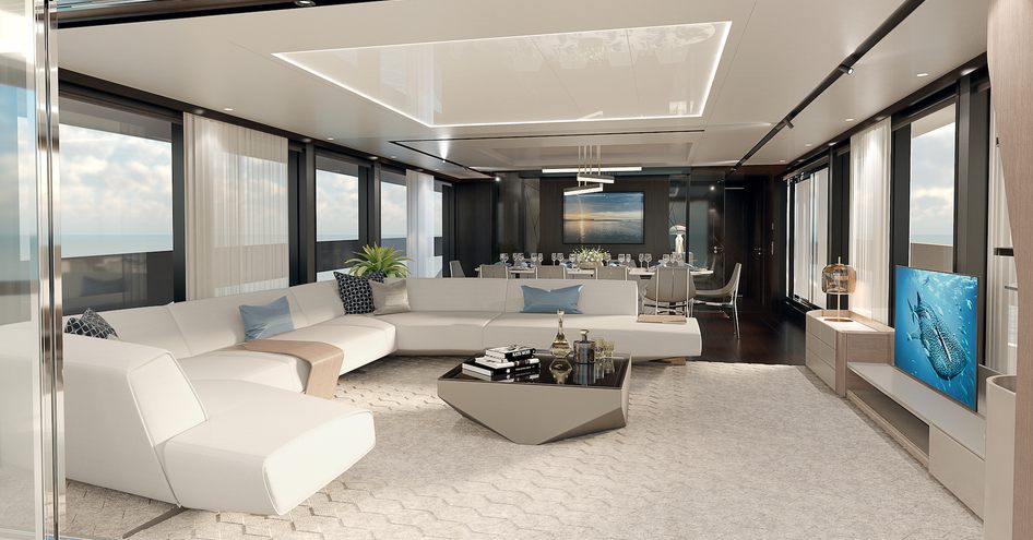 white U-shaped sofa and a coffee table face a TV in the main salon of Sunseeker 100 Yacht