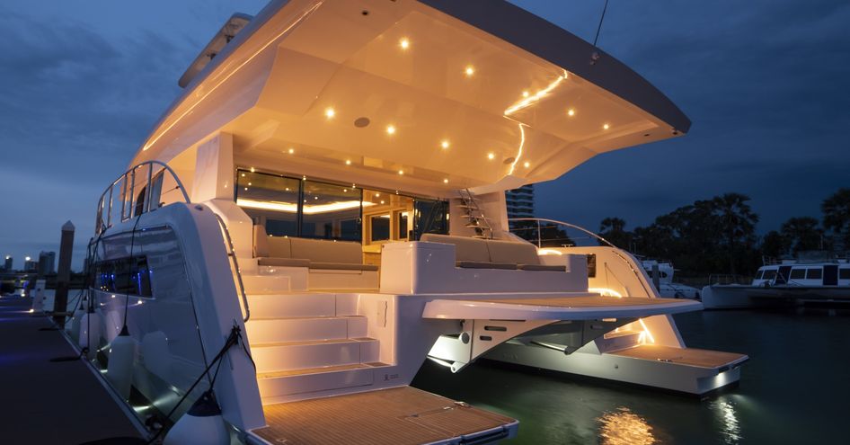 Sea level view of Silent 60 aft deck, dual swim platforms visible with steps leading to main deck.