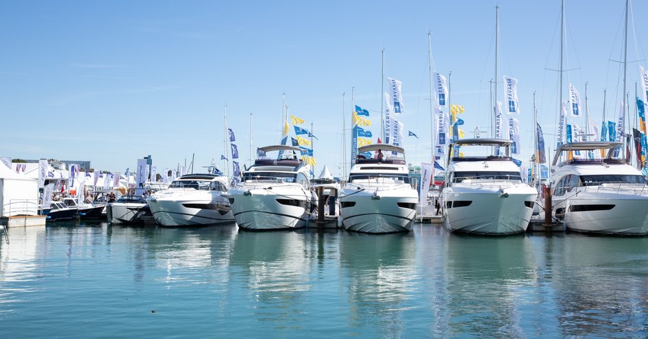 Line up of boats at Southampton International Boat Show, surrounded by sea and blue sky