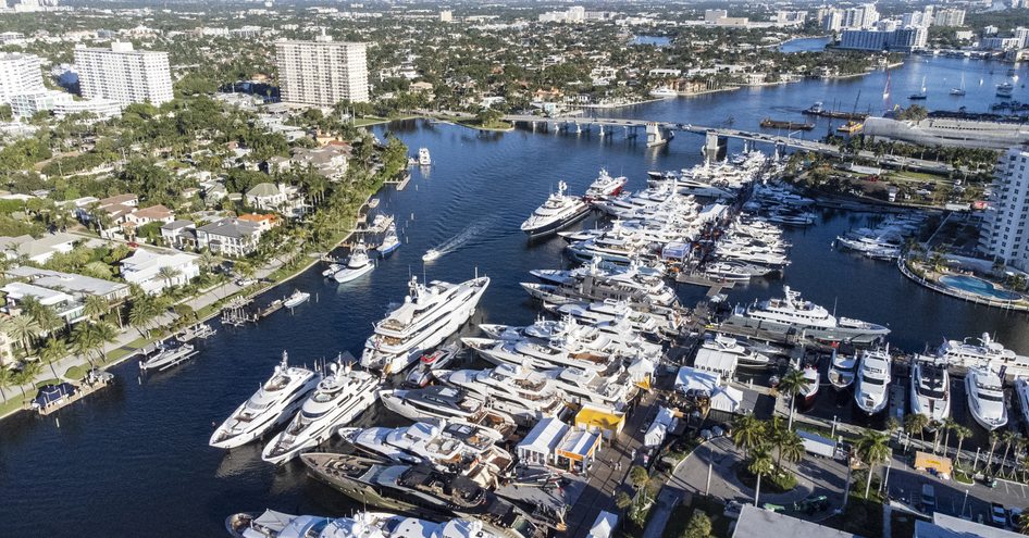 Aerial view of Fort Lauderdale during FLIBS. Many yachts berthed in marinas, surrounded by high-rise buildings.