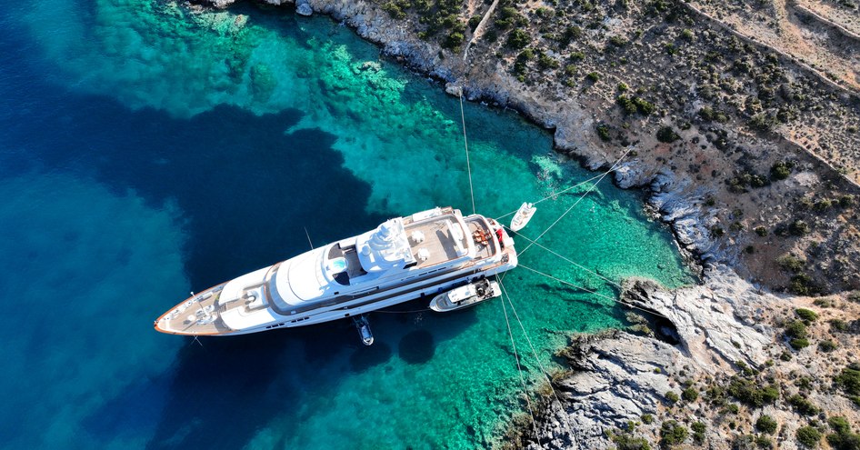 aerial superyacht anchored with tenders