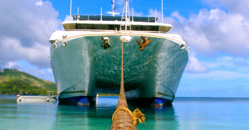 catamaran moored in shallow waters