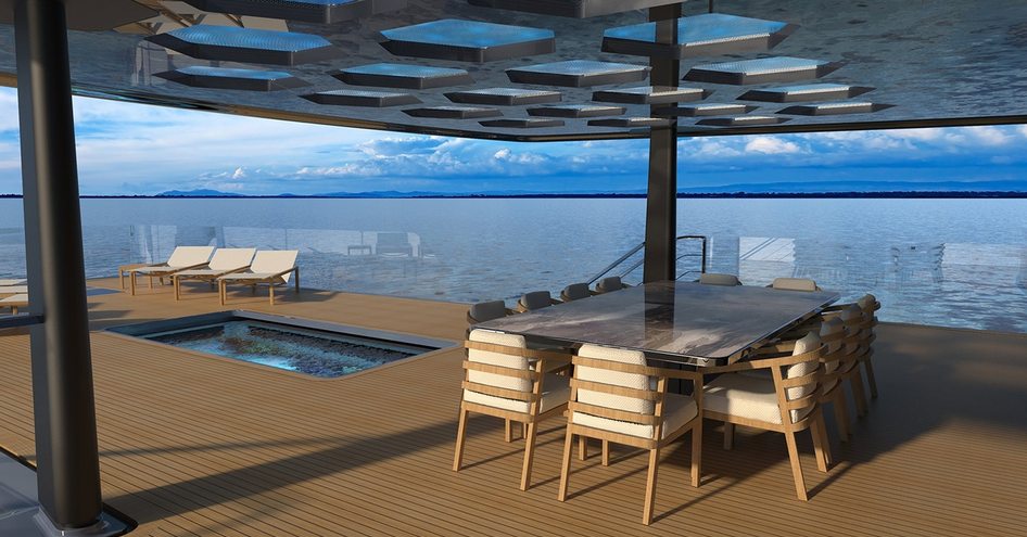 dining table with chairs under the shade while pool and sunloungers open to the sun on the deck of the V-Line model