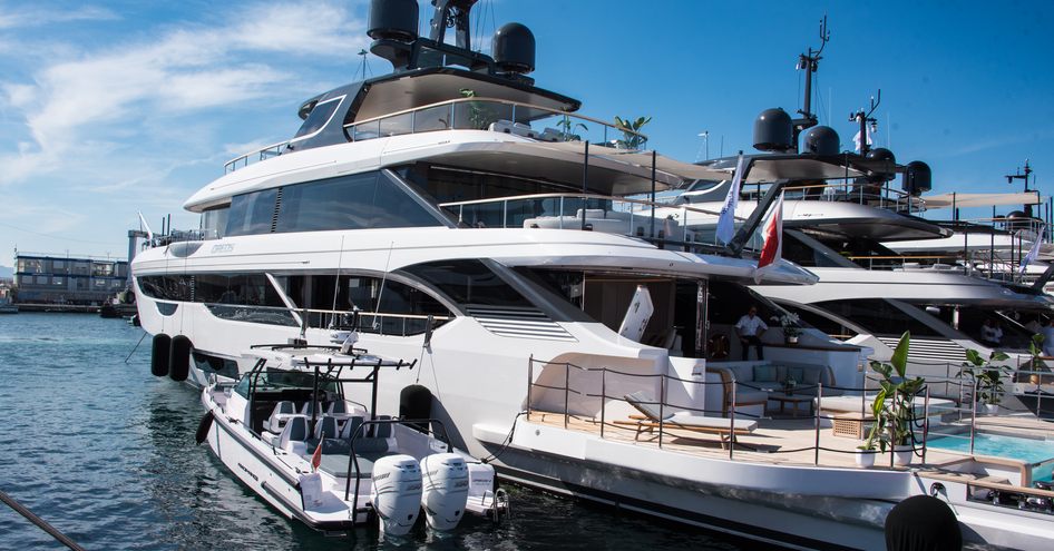 Aft view of a pair of superyachts berthed at the Cannes Yachting Festival