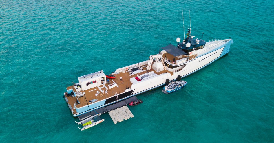 An aerial shot of support vessel SHADOW showcasing its expansive decks and watertoys 