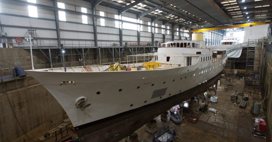 Classic superyacht MARALA in outfitting area for restoration