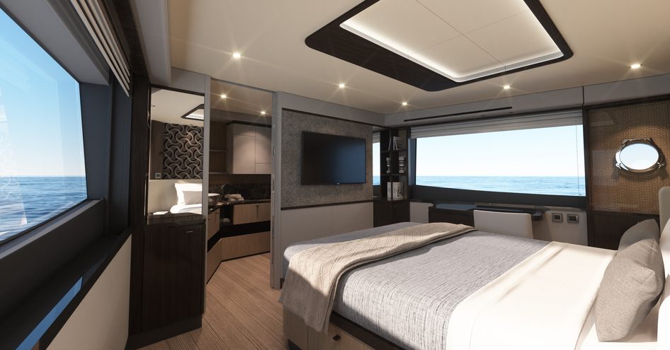 Cabin on Absolute 60FLY with wide windows and bed facing TV