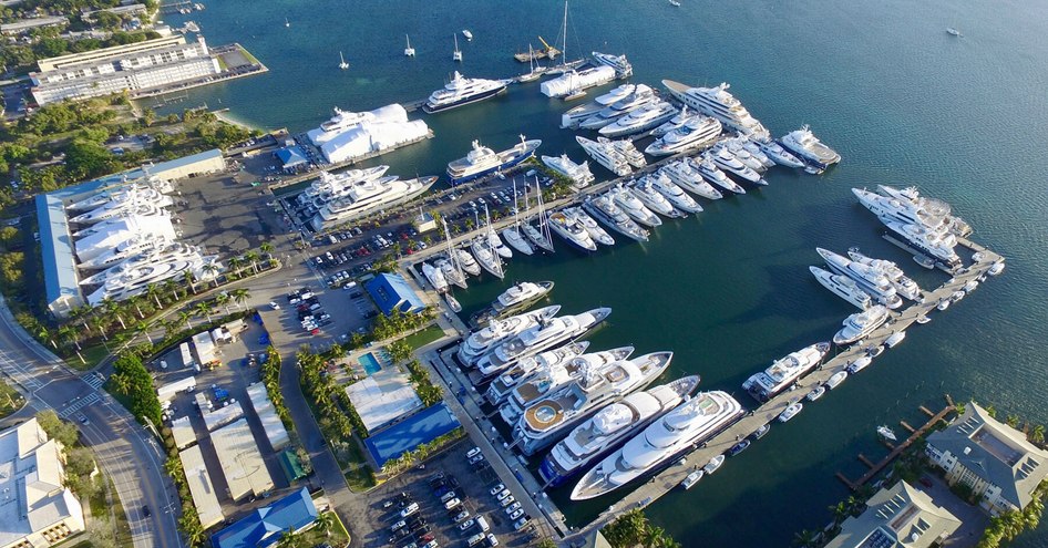 Aerial view of Rybovich marina Palm Beach, multiple superyachts moored, surrounded by river