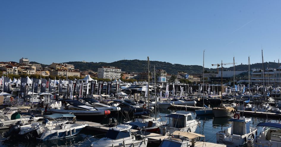 Port Canto during Cannes Yachting Festival, many motor yachts and sailing boats berthed.