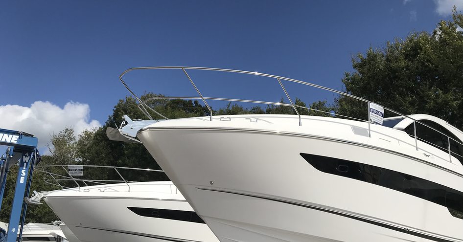 Boat yard with a selection of medium sized motor yachts for sale