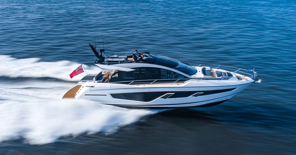 Side view of Sunseeker 65 Sport Yacht underway, surrounded by sea