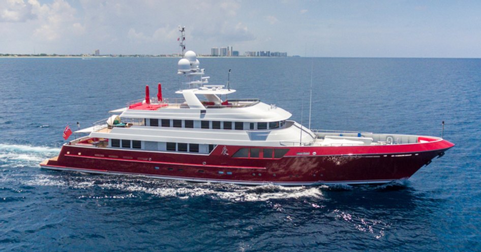 Cheoy Lee explorer yacht AVALON cutting through a light blue sea