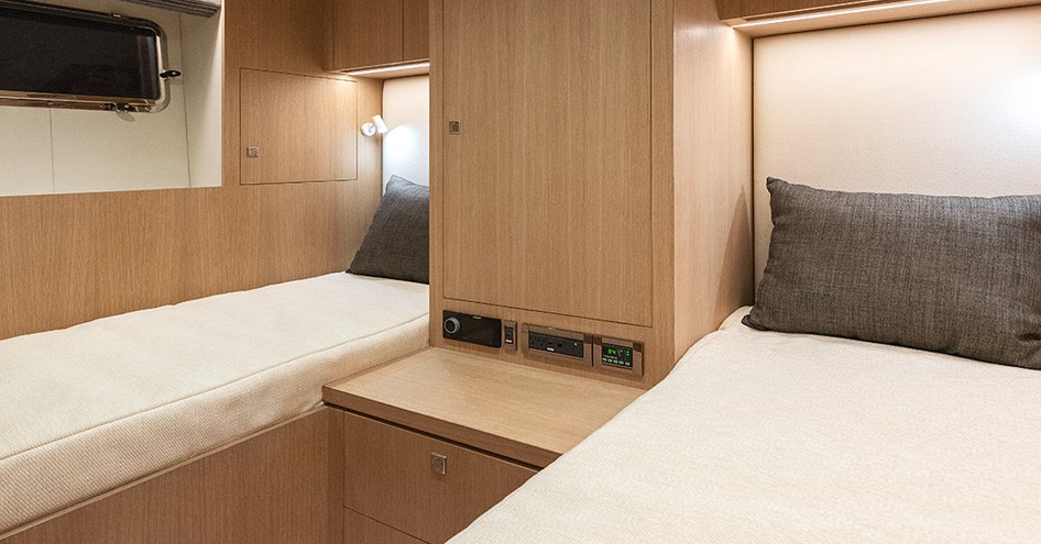 Cabin showing plug points in cabin next to bed