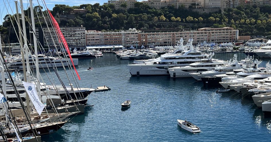 Motor yachts and sailing boats moored in Port Hercule at launch of Monaco Yacht Show.