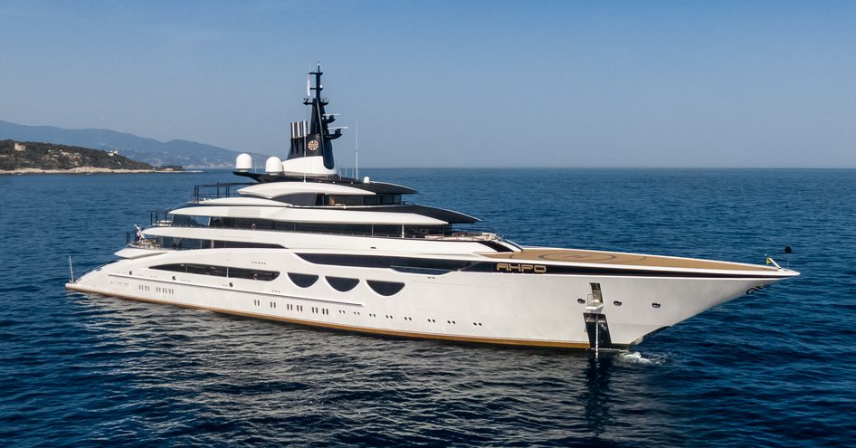 Superyacht AHPO at anchor, surrounded by sea.