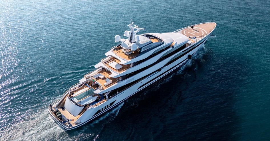 Admiral Yachts 78m superyacht PLATINUM shown in a running shot over starboard quarter and side profile, Making slight wake in calm sea on bright day