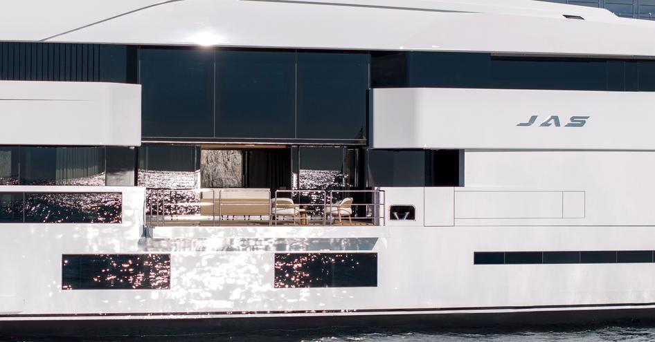 A close-up showing the full-height, sliding glass doors and fold-down balconies onboard superyacht JAS